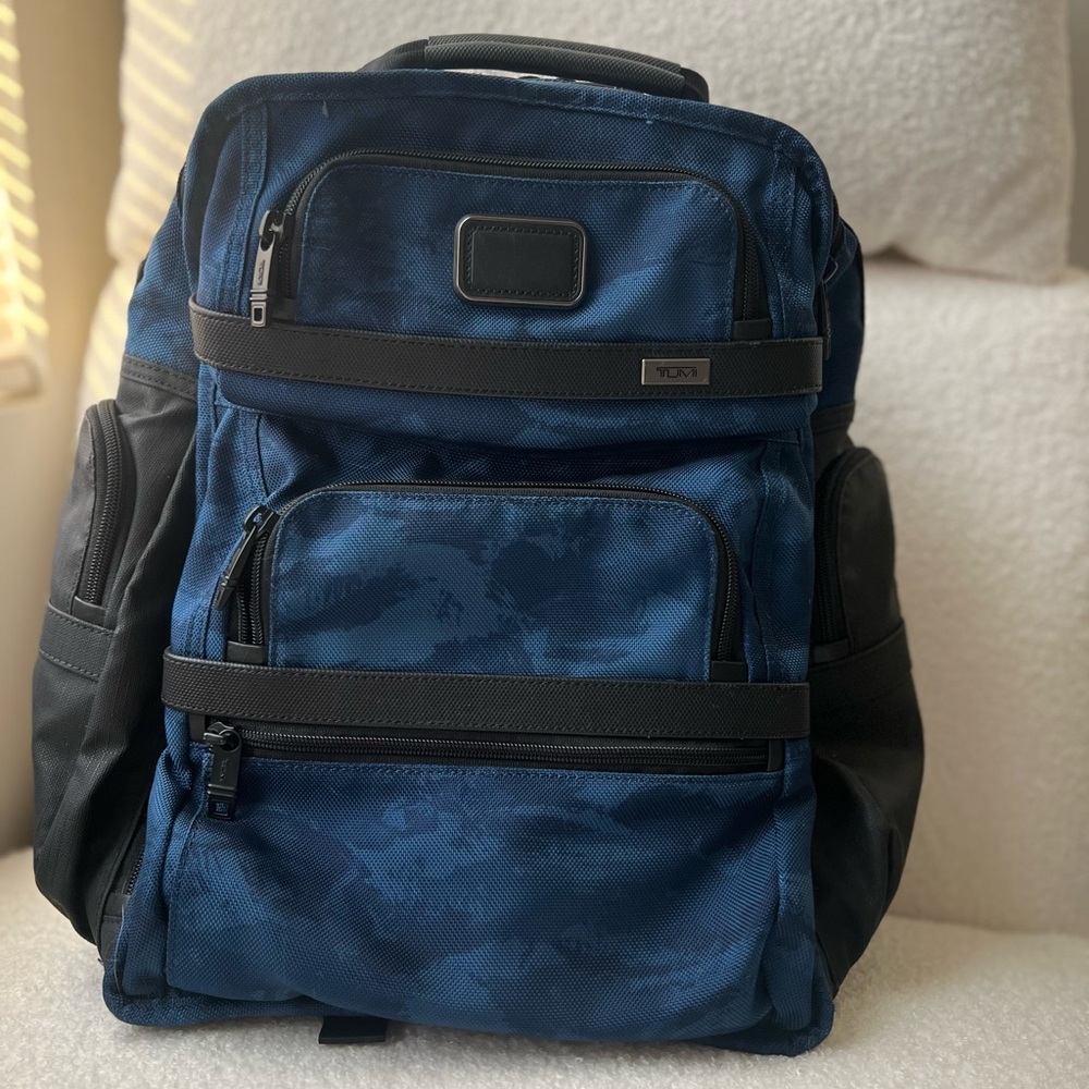 Tumi Blue and Black Backpack with Durable Design
